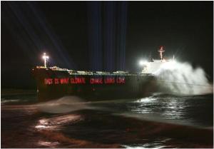 Greenpeace Australia shine the words "this is what climate change looks like" onto the hull of the Pasha Bulker tanker which beached in Newcastle, Australia